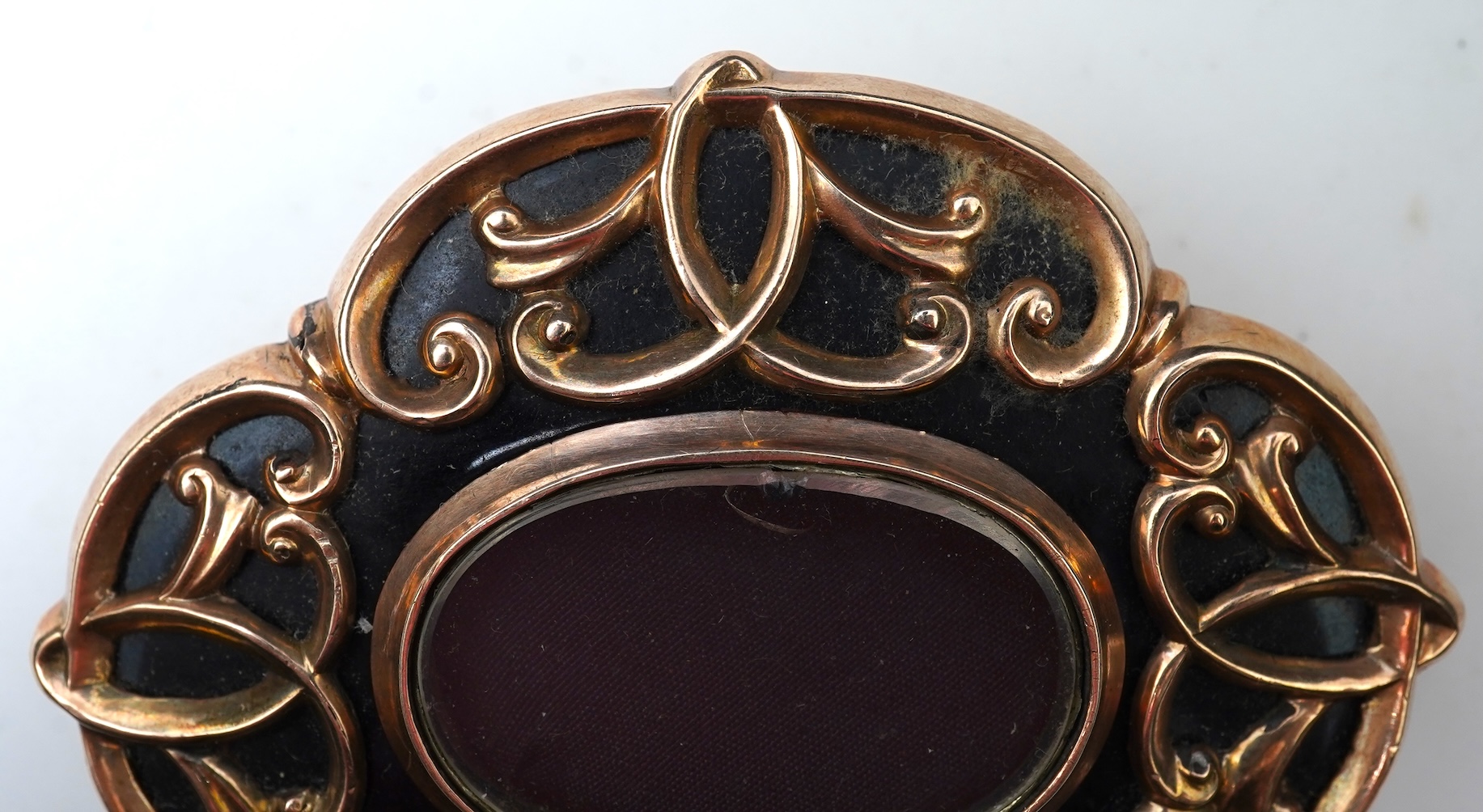 A Victorian rolled gold and enamel locket brooch/pendant, late 19th century